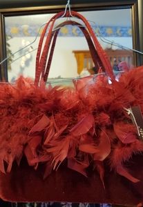 Red velvet and feather evening bag